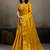 Mustard yellow linen silk blend saree with gold zari bootas and tassels