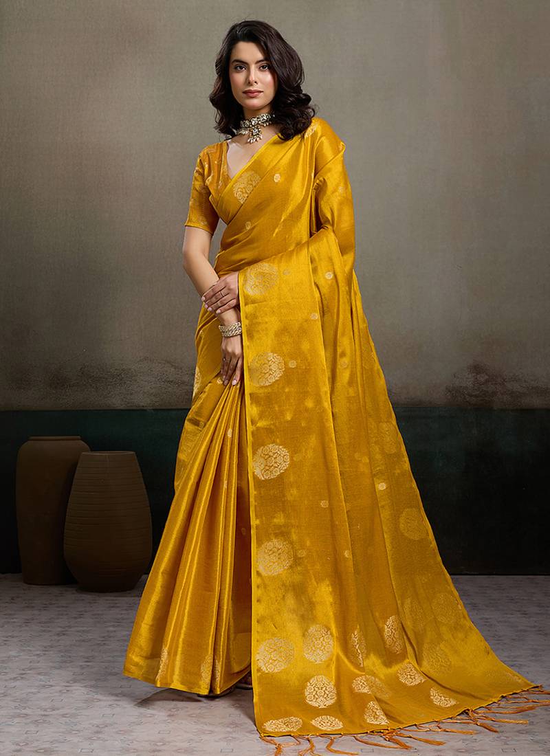 Mustard yellow linen silk blend saree with gold zari bootas and tassels