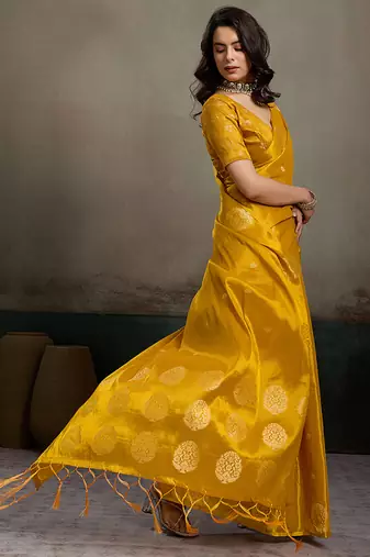 Mustard yellow linen silk blend saree with gold zari bootas and tassels