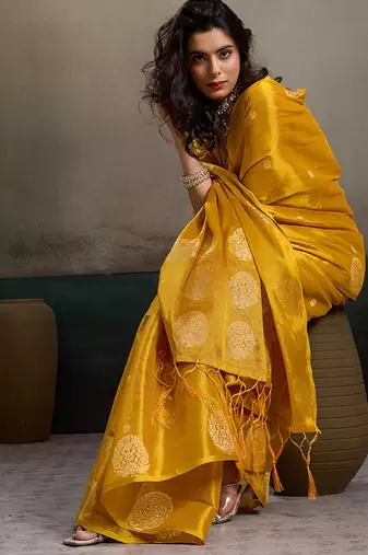 Mustard yellow linen silk blend saree with gold zari bootas and tassels