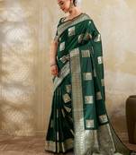 Dark green zari woven banarasi silk blend saree with blouse piece