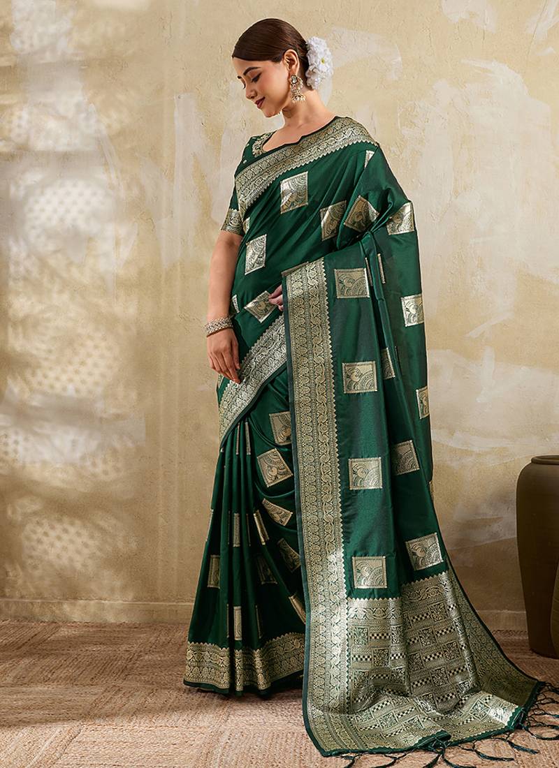 Dark green zari woven banarasi silk blend saree with blouse piece