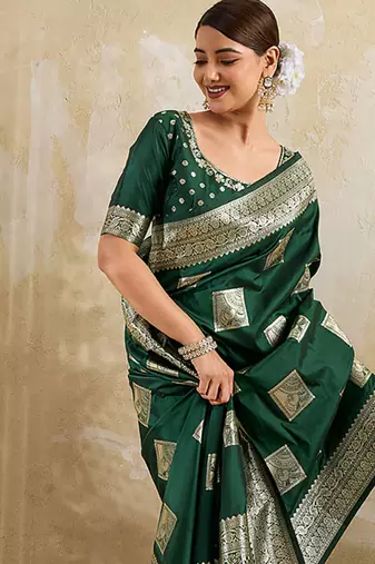 Dark green zari woven banarasi silk blend saree with blouse piece
