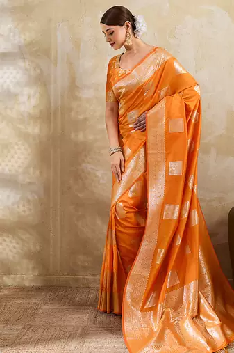 Orange zari woven banarasi silk blend saree with blouse piece