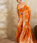 Orange zari woven banarasi silk blend saree with blouse piece