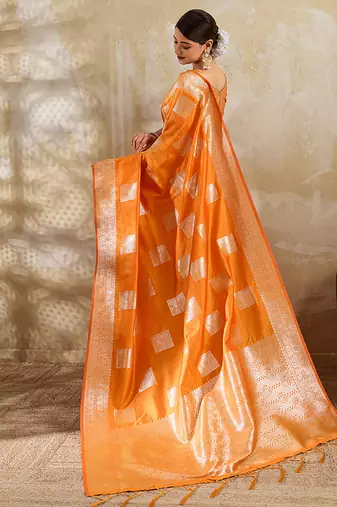 Orange zari woven banarasi silk blend saree with blouse piece