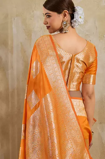 Orange zari woven banarasi silk blend saree with blouse piece