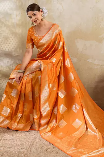 Orange zari woven banarasi silk blend saree with blouse piece