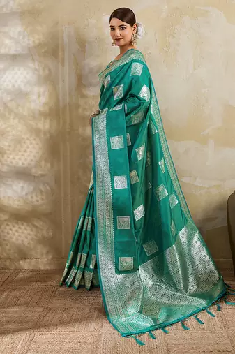 Teal zari woven banarasi silk blend saree with blouse piece
