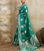 Teal zari woven banarasi silk blend saree with blouse piece