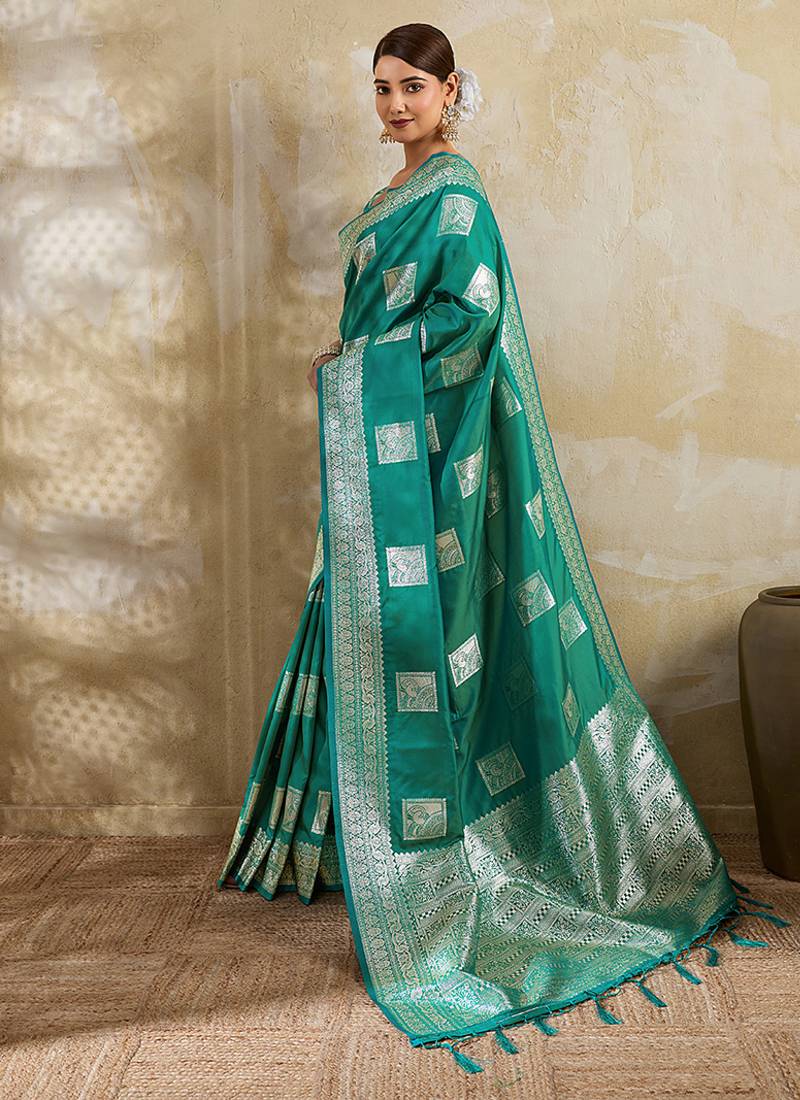 Teal zari woven banarasi silk blend saree with blouse piece