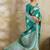 Teal zari woven banarasi silk blend saree with blouse piece