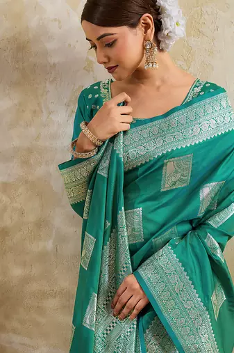 Teal zari woven banarasi silk blend saree with blouse piece