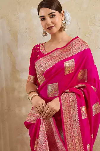 Rani pink zari woven banarasi silk blend saree with blouse piece