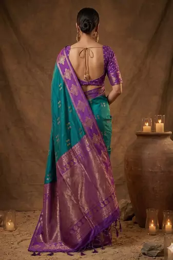 Teal blue zari woven banarasi silk blend saree with blouse piece
