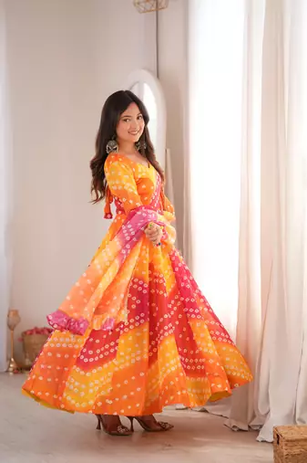 Orange printed tebby organza gown pant set with dupatta