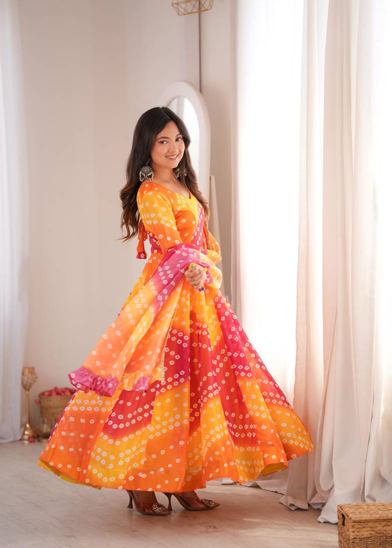 Orange printed tebby organza gown pant set with dupatta