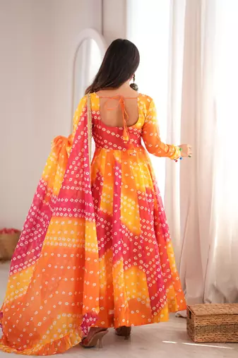 Orange printed tebby organza gown pant set with dupatta