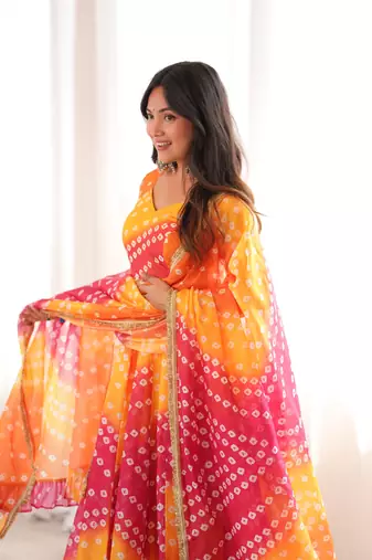 Orange printed tebby organza gown pant set with dupatta