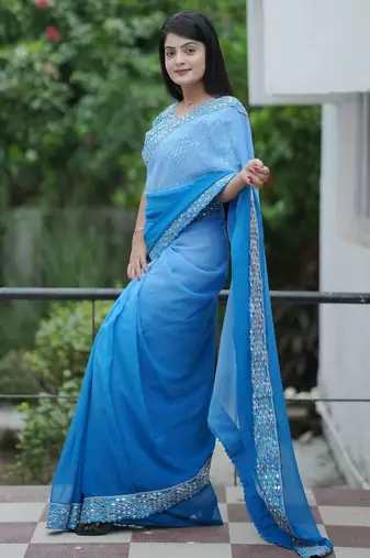 Teal faux georgette embroidered mirror work heavy look ethnic saree with blouse