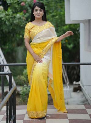 Yellow faux georgette embroidered mirror work heavy look ethnic saree with blouse 1