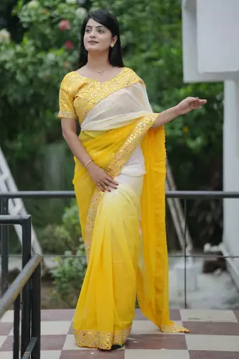 Yellow faux georgette embroidered mirror work heavy look ethnic saree with blouse