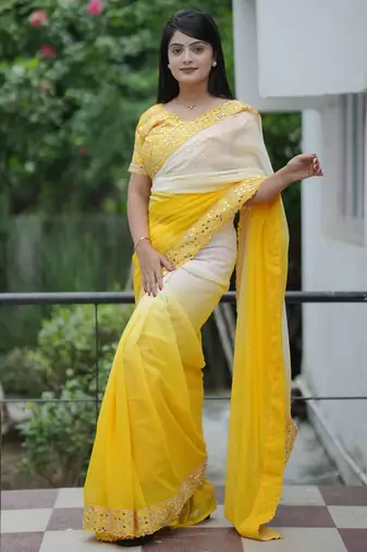 Yellow faux georgette embroidered mirror work heavy look ethnic saree with blouse