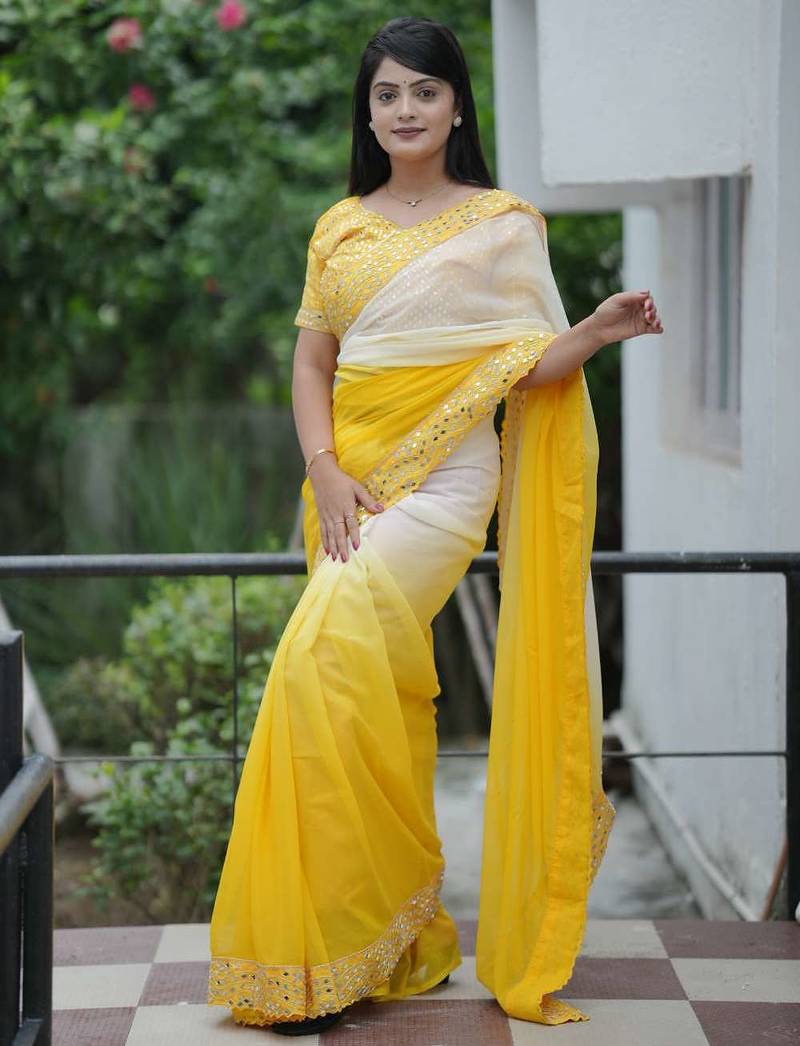 Yellow faux georgette embroidered mirror work heavy look ethnic saree with blouse