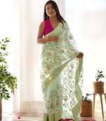 Green organza embroidered zari woven heavy look ethnic saree with blouse