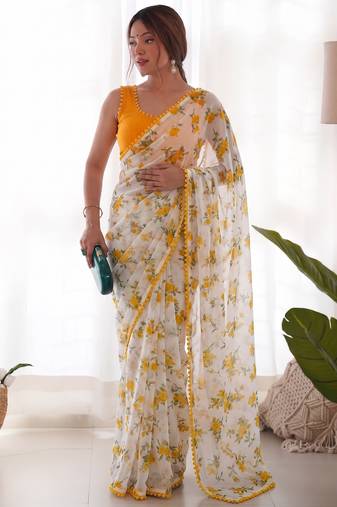 Yellow heavy chiffon printed lace border saree with blouse