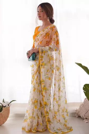 Yellow heavy chiffon printed lace border saree with blouse