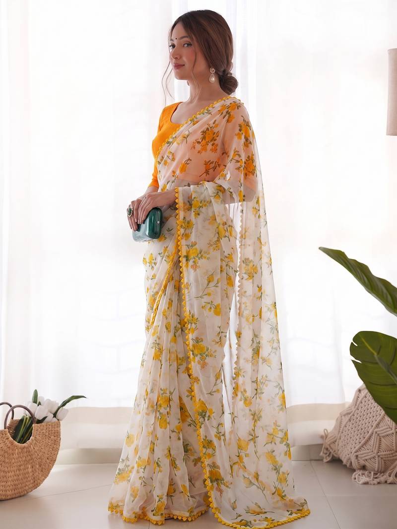 Yellow heavy chiffon printed lace border saree with blouse