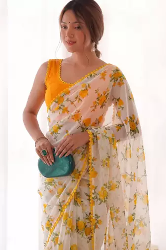 Yellow heavy chiffon printed lace border saree with blouse