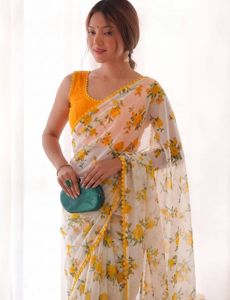 Yellow heavy chiffon printed lace border saree with blouse