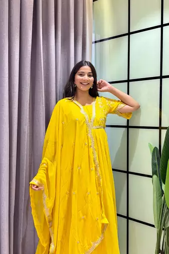 yellow color multi-sequin and zari embroidered faux blooming georgette gown set