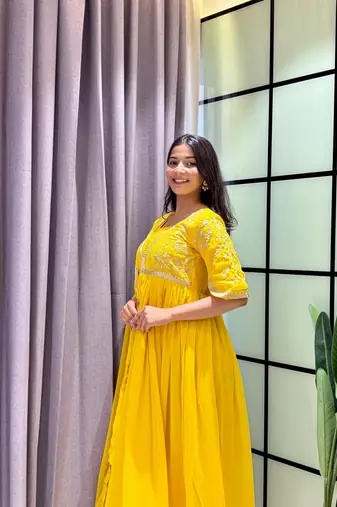 yellow color multi-sequin and zari embroidered faux blooming georgette gown set