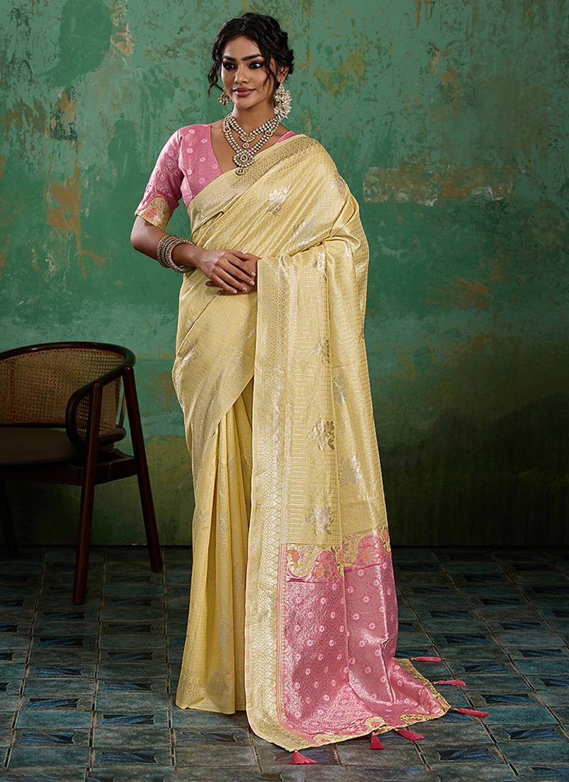 Pastel yellow & pink zari woven linen silk blend saree with floral motifs