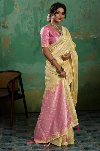 Pastel yellow & pink zari woven linen silk blend saree with floral motifs
