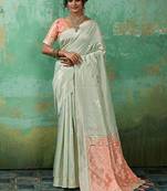 Mint green & peach zari woven linen silk bend saree with floral motifs
