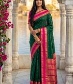 Dark green & rani pink zari woven banarasi silk blend saree