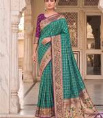 Teal banarasi silk blend saree with paithani floral pallu