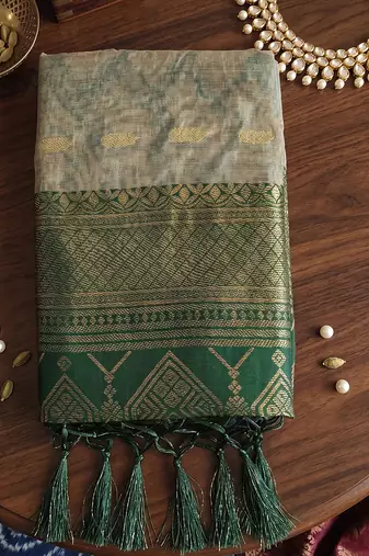 Beige cotton-silk blend saree with contrast dark green zari border