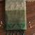 Beige cotton-silk blend saree with contrast dark green zari border