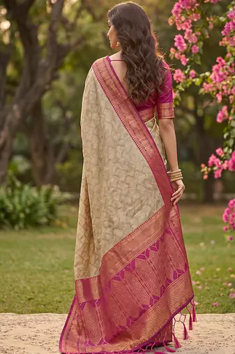 Beige cotton-silk blend saree with contrast rani pink zari border