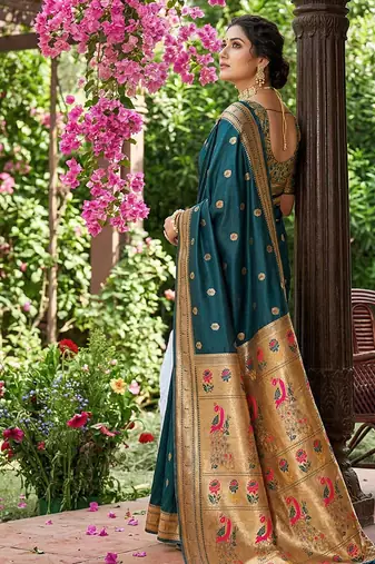 Dark teal banarasi silk blend saree with peacock paithani border