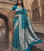 Teal blue banarasi silk saree with gold zari floral meenakari work