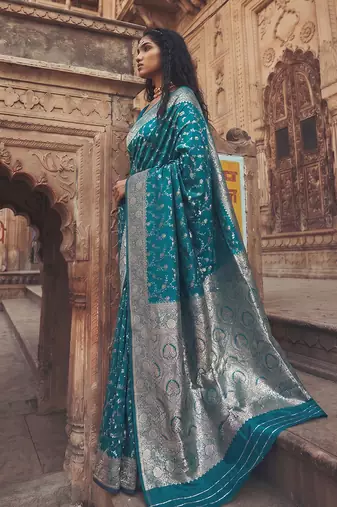 Teal blue banarasi silk saree with gold zari floral meenakari work
