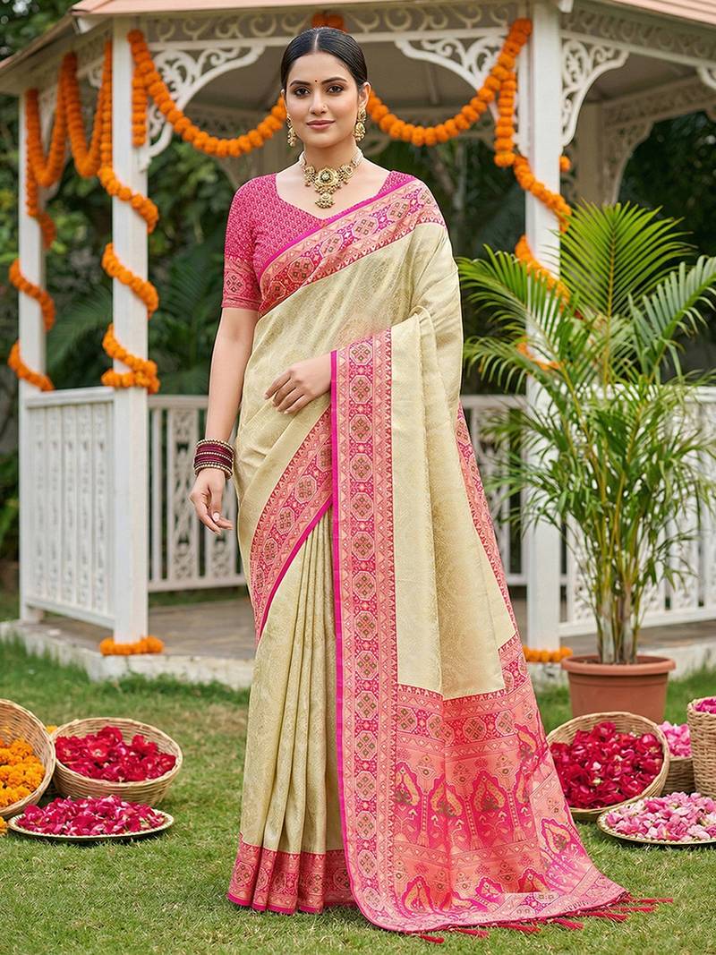 Cream banarasi silk blend saree with rani pink zari woven border
