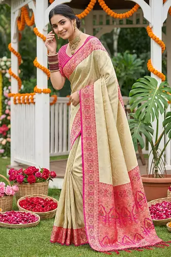 Cream banarasi silk blend saree with rani pink zari woven border