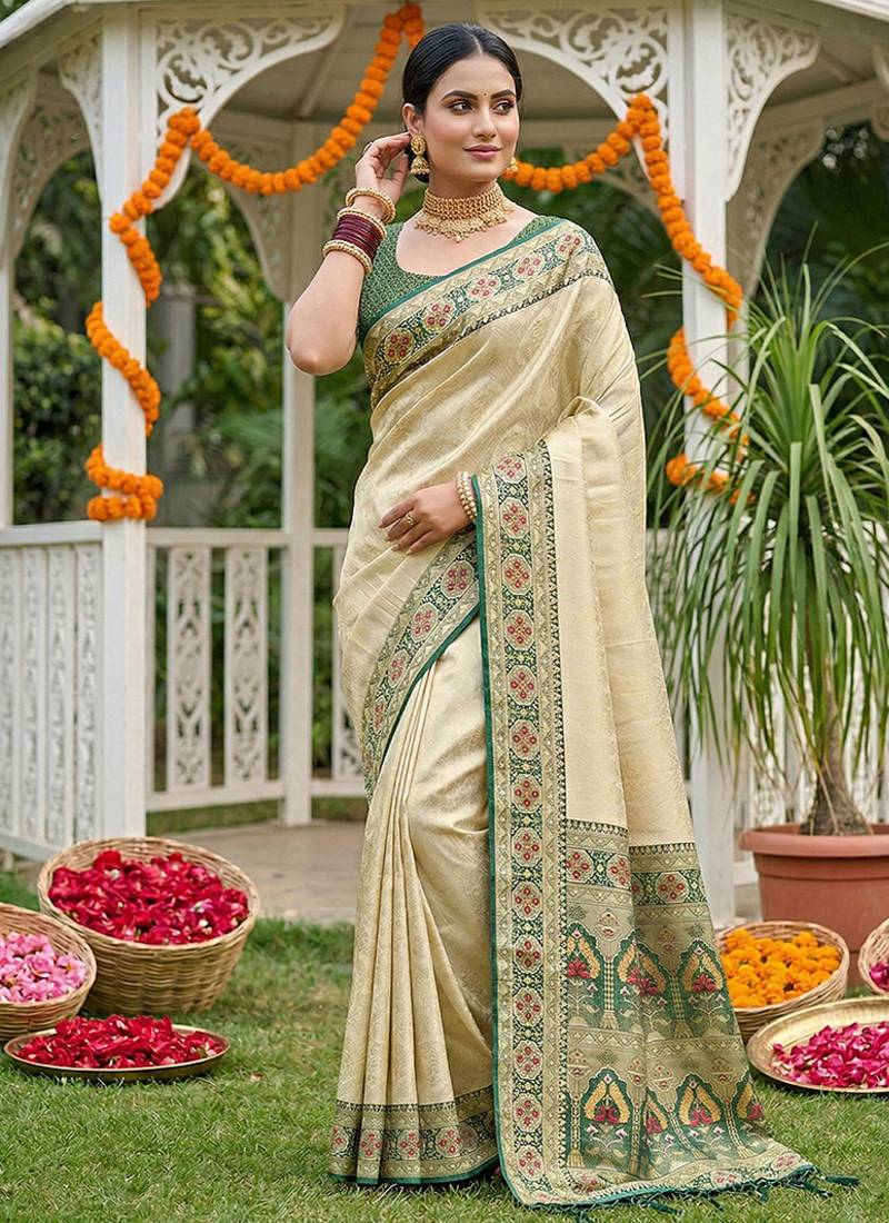 Cream banarasi silk blend saree with dark green zari woven border